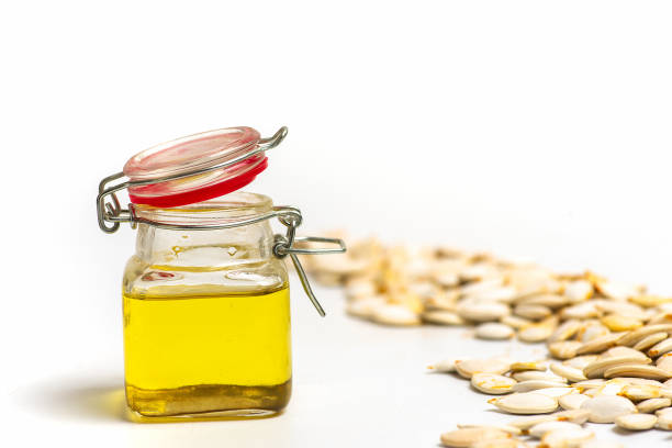 istock Healthy pumpkin seeds oil in a bottle 1321473253
