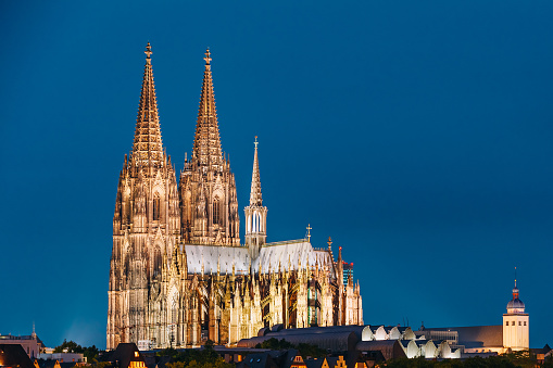 Cologne, Germany. Night View Of Cologne Cathedral. Catholic Gothic Cathedral In Dusk, Evening. UNESCO World Heritage Site. Famous Place And Destination Scenic