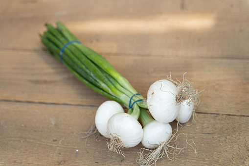 White onions on wooden table