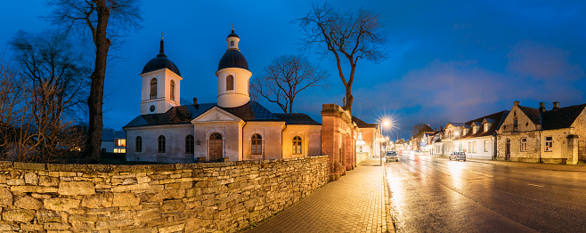 Kuressaare, Estonia. Church Of St. Nicholas In Blue Hour Evening Night. Street. Panorama, panoramic view.