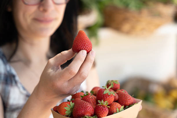 istock Farmer with organic strawberry 1321478097
