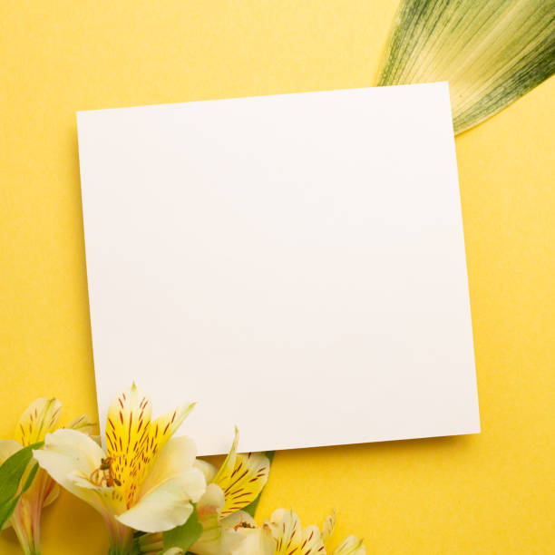 istock Memo pad with Alstroemeria flowers on yellow background. top view, copy space 1321479171
