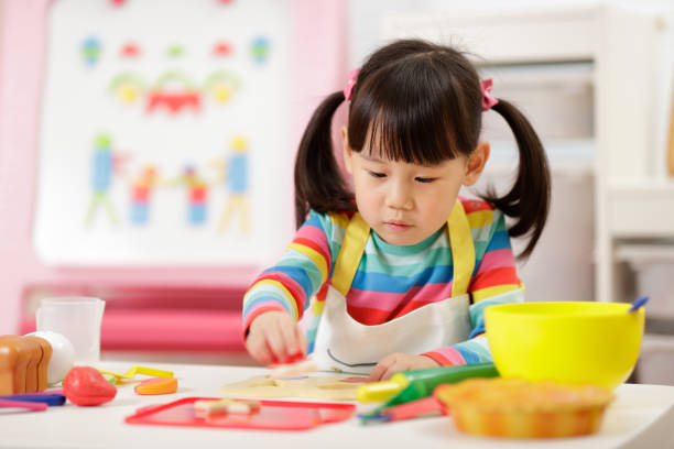 istock Cute Girl Playing At Home 1321483016