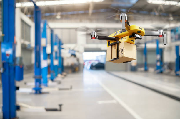 Flying delivery drone transferring parcel box from distribution warehouse to automotive garage customer service repair center background. Modern innovative technology and gadget concept. stock photo