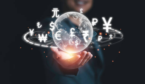 istock Global currency exchange concept, Hand holding world with virtual line effect and dollar yuan yen euro and pound sterling sign. 1321485650