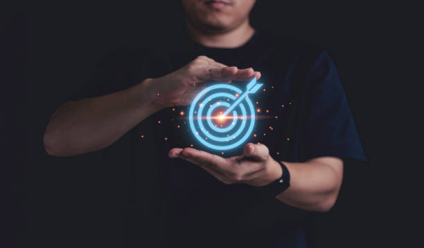 istock Businessman holding virtual blue dartboard with arrow ,Business Achievement objective target concept. 1321486303