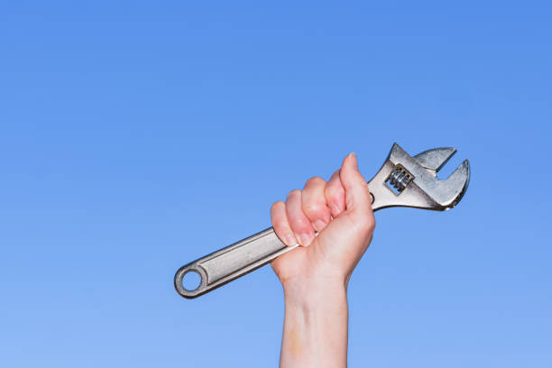 istock Monkey wrench in the background of blue sky 1321487641