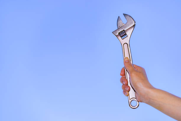 istock Monkey wrench in the background of blue sky 1321487642