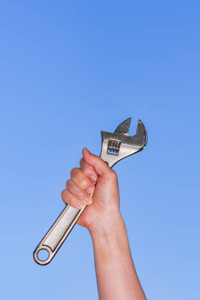 istock Monkey wrench in the background of blue sky 1321487652