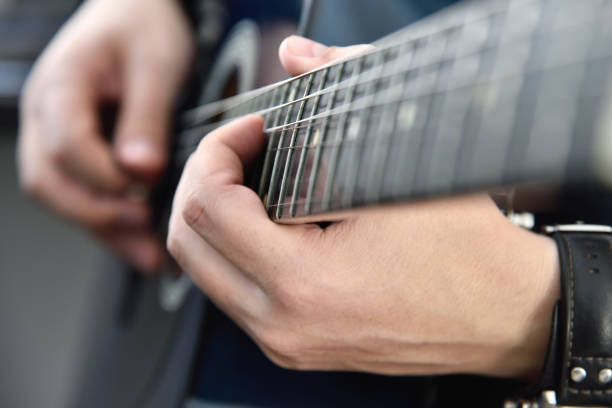 istock Guitarist playing on acoustic guitar. 1321490662