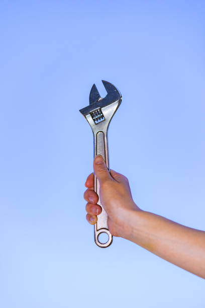 istock Monkey wrench in the background of blue sky 1321490771