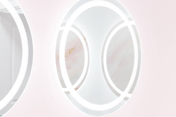 istock Round mirrors with illuminated reflections, modern design pastel blue and pink stylized in a beauty studio salon 1321490814