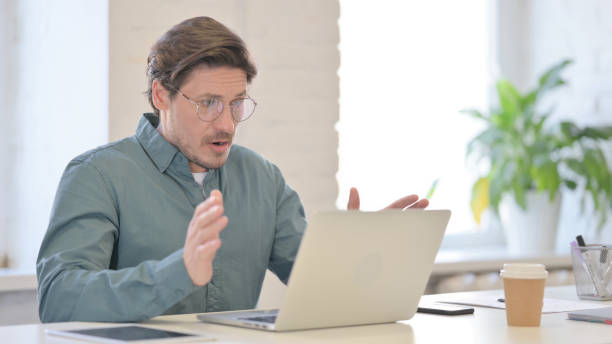 istock Middle Aged Man with Laptop having Loss, Failure 1321490888