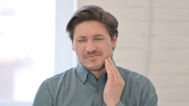 istock Portrait of Middle Aged Man having Toothache, Cavity 1321491002