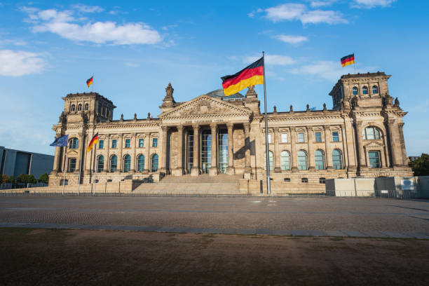 German Parliament (Bundestag) - Reichstag Building with German Flag - Berlin, Germany German Parliament (Bundestag) - Reichstag Building with German Flag - Berlin, Germany - Text says: To the German People the reichstag stock pictures, royalty-free photos & images