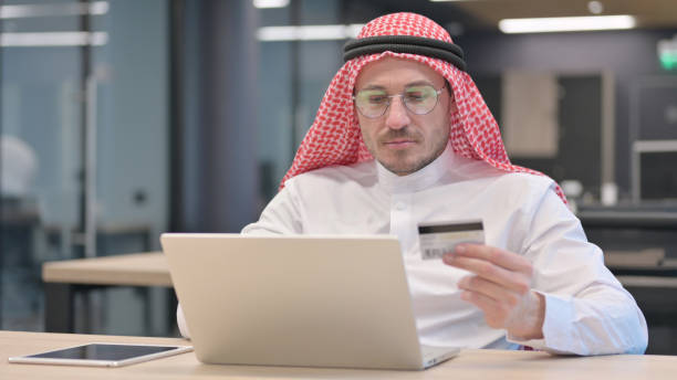 istock Successful Online Payment on Laptop by Middle Aged Man 1321492891