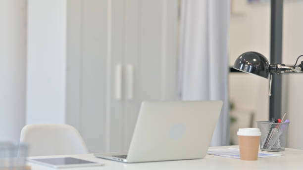 istock Young Woman Closing Laptop and Going Away 1321493973