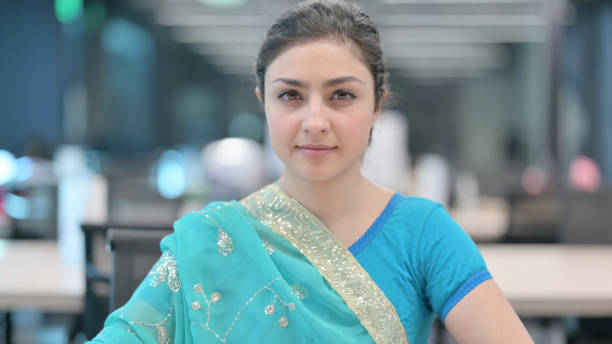 istock Young Indian Woman Looking towards Camera 1321493999