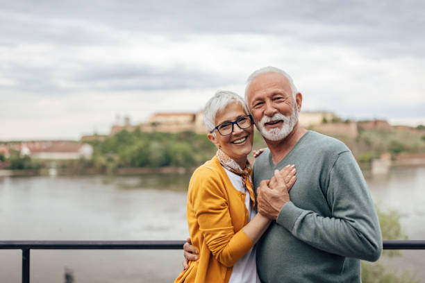 istock Mature husband and wife, passionately hugging, outside. 1321496860