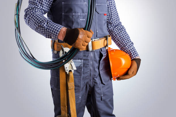 istock Electrician with wires on grey background. 1321497012