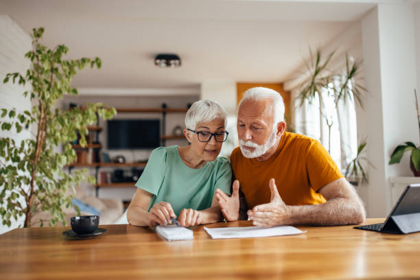 istock Senior husband, trying to help his wife with work. 1321497106