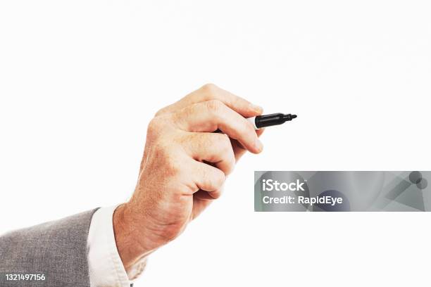 Hand Of Businessman Wearing Suit Holds A Felttip Pen Poised To Write Stock Photo - Download Image Now