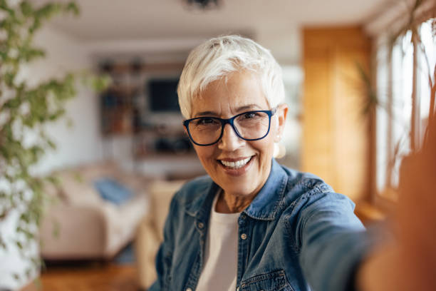 istock Mature woman, taking a brake from work, at home. 1321497187