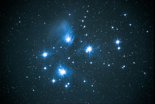 Computer drawn space starlight on a dark blue background