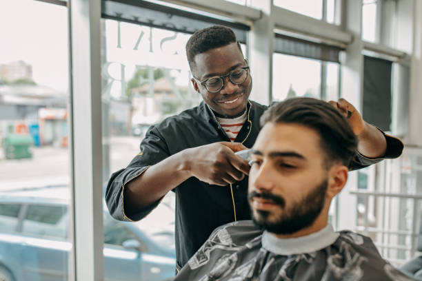 istock Barber working on the new hairstyle 1321501332