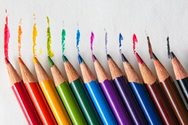 istock Aligned colored pencil strokes and pencils on white  paper 1321501529