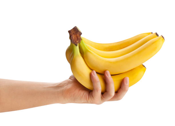 istock banana bunch in hand 1321502453