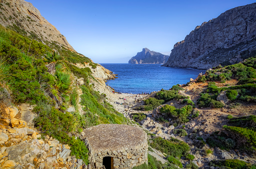 Cala Bóquer is a small bay with a pebble beach on the northwest coast of the Spanish Balearic island of Mallorca. It is located in the north of the municipality of Pollença on the Formentor peninsula, about 11 kilometers southwest of Cap Formentor.