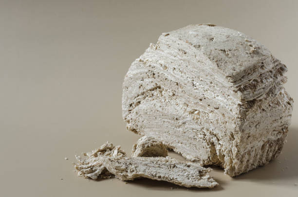 istock Peanut halva on a light brown background top view-side space for text. Halva oriental sweets 1321505916