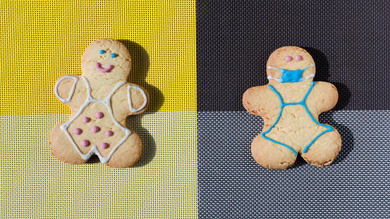 The concept of self-isolation and limitation of covid is the figure of a man in a cookie mask on a dark background and a happy man on a light background. Sweet cookie dessert figure of a masked man