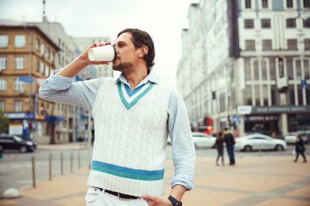 istock Kind bearded man tasting aroma coffee during walk 1321507287