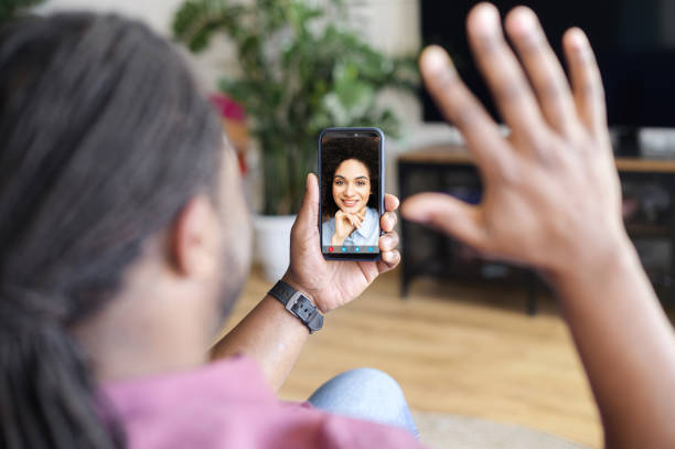 istock African-American man using smartphone for video connect 1321508770
