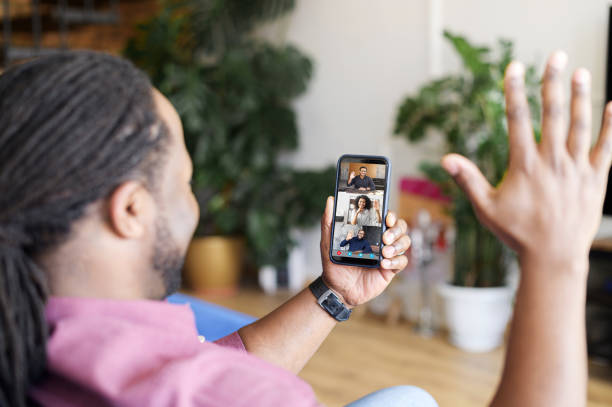istock African-American man using smartphone for video connect 1321509096