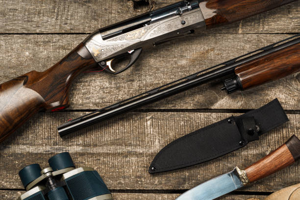 istock Various hunting equipment on old wooden background 1321509294
