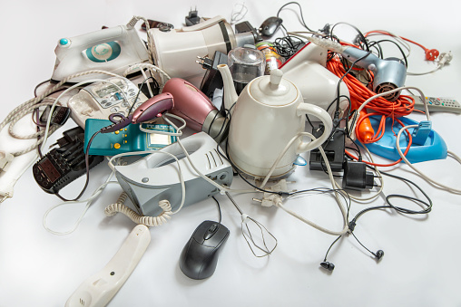 Lots of old electrical appliances for recycling e-waste. Sustainable living concept.