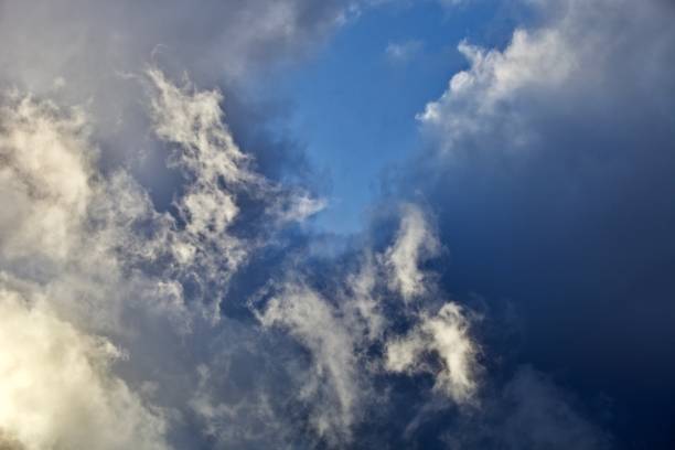 istock Bright colorful storm clouds in the sunset sky 1321509994