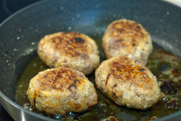 istock Raw cutlets made of ground beef meat. coocking process 1321511066