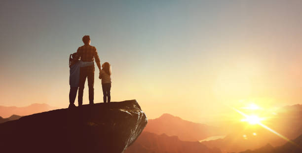 istock Happy family at sunset. 1321513439