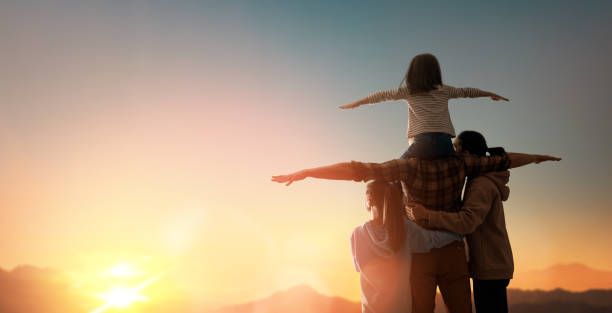 istock Happy family at sunset. 1321513443