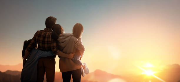 istock Happy family at sunset. 1321513451