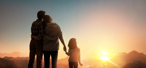 istock Happy family at sunset. 1321513458