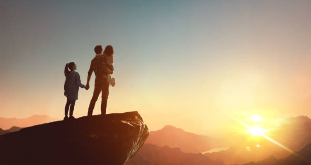 istock Happy family at sunset. 1321514260