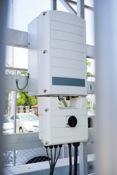 istock Inverter behind the solar panels 1321514835