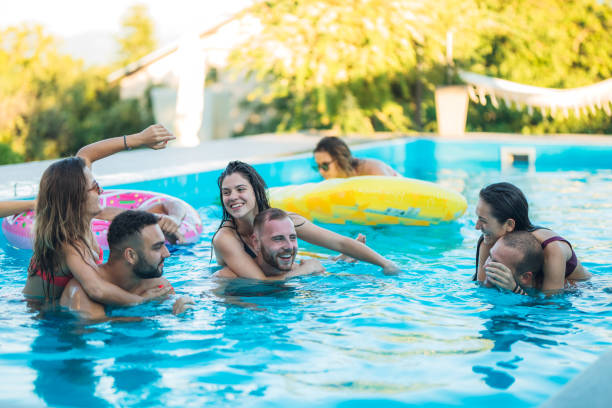 istock Friends at a poolside party 1321518749