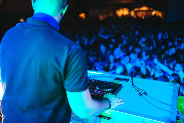 istock DJ playing and mixing music at party 1321521743