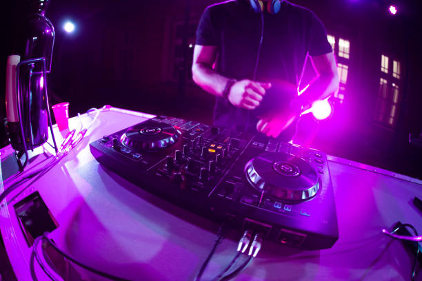 istock DJ playing and mixing music at party 1321521798